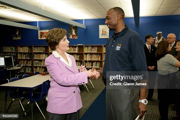 Former first lady Laura Bush greets Jason Terry of the Dallas Mavericks during the NBA Cares All-Star 2010 Community Caravan at the Farrell...