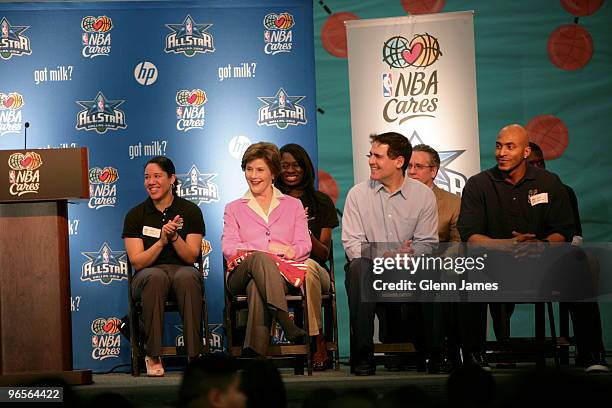 Former first lady Laura Bush and Owner Mark Cuban of the Dallas Mavericks smiles during the NBA Cares All-Star 2010 Community Caravan at the Farrell...