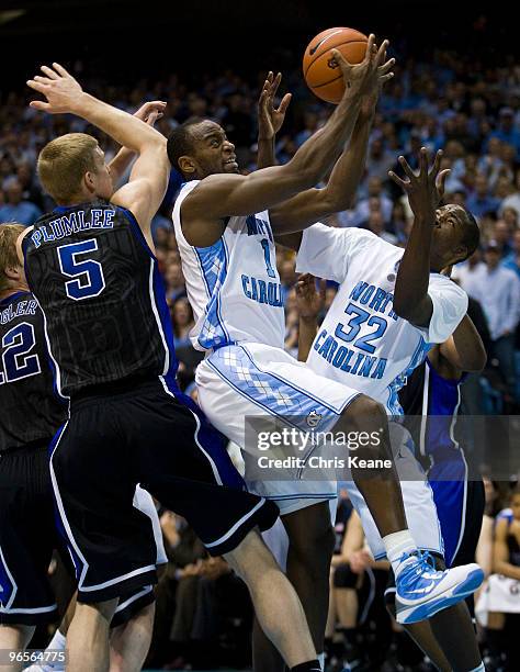 North Carolina guard/forward Marcus Ginyard works to drive the ball against Duke forward Mason Plumlee during a men's college basketball game at Dean...