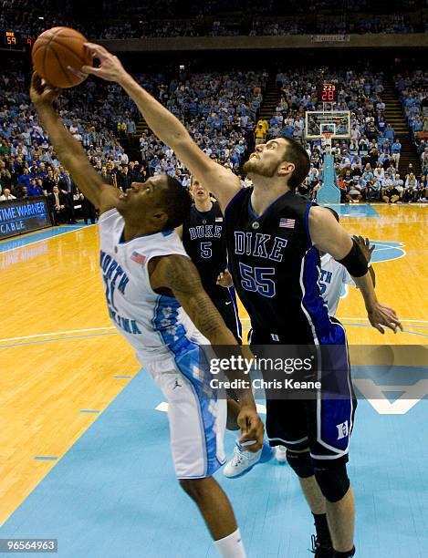 Duke center Brian Zoubek works for a rebound against North Carolina forward Deon Thompson during a men's college basketball game at Dean Smith Center...