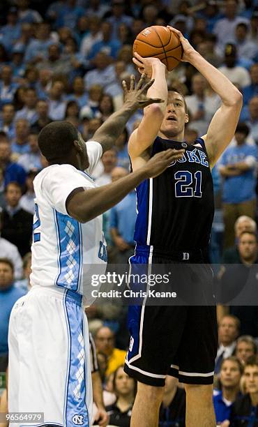 Duke forward Miles Plumlee shoots against a North Carolina defender during a men's college basketball game at Dean Smith Center on February 10, 2010...