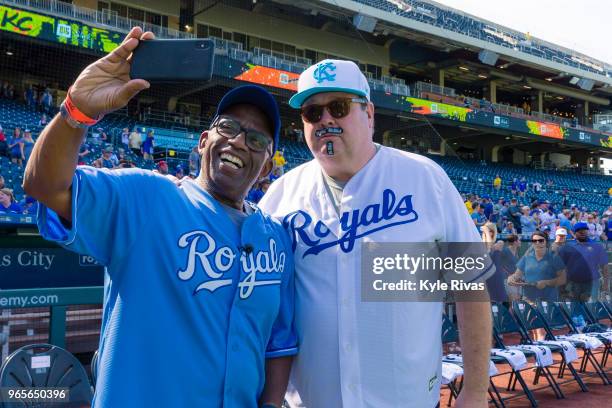Al Roker and Eric Stonestreet pose for a photo during in the celebrity softball game at Kauffman Stadium during the Big Slick Celebrity Weekend...