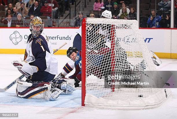 Chris Stewart of the Colorado Avalanche beats goaltender Johan Hedberg of the Atlanta Thrashers to score a goal at the Pepsi Center on February 10,...