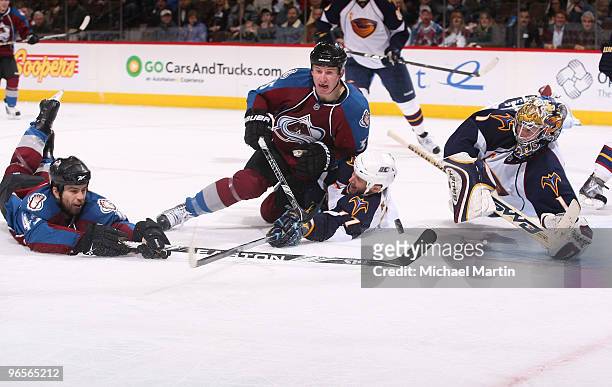 Chris Durno of the Colorado Avalanche dives for the puck to beat goaltender Johan Hedberg of the Atlanta Thrashers to score a goal, as Cody McLeod...