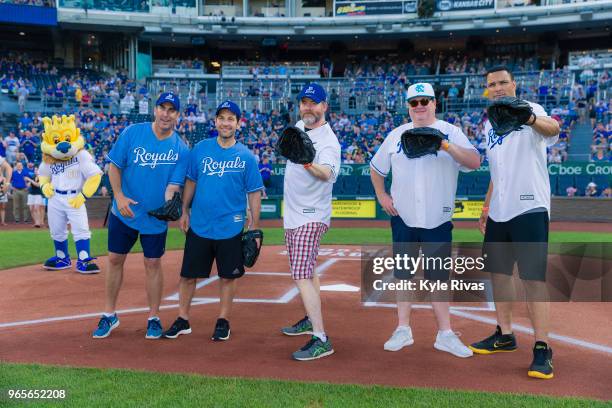 Rob Riggle, Paul Rudd, David Koechner, Eric Stonestreet and Tony Gonzales pose for a photo while taking part in the first pitch during the Big Slick...