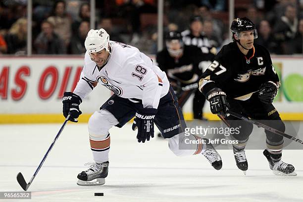 Ethan Moreau of the Edmonton Oilers steals the puck from Scott Niedermayer of the Anaheim Ducks enroute to a shorthanded goal in the second perid at...