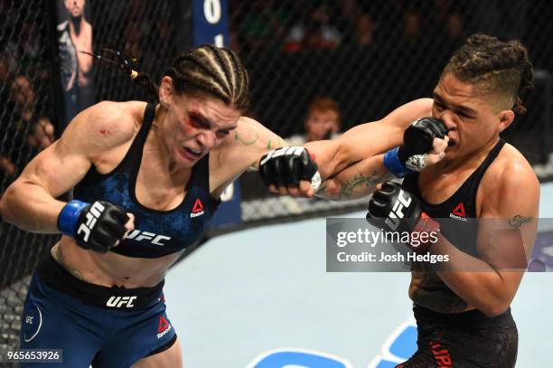 Lauren Murphy punches Sijara Eubanks in their women's flyweight fight during the UFC Fight Night event at the Adirondack Bank Center on June 1, 2018...