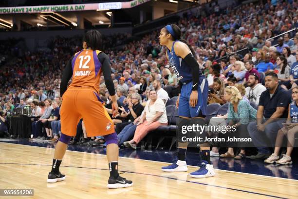 Briann January of the Phoenix Mercury plays defense against Maya Moore of the Minnesota Lynx on June 1, 2018 at Target Center in Minneapolis,...