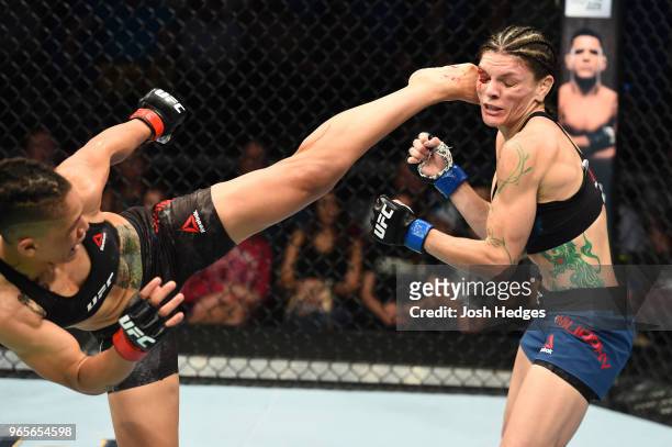 Sijara Eubanks kicks Lauren Murphy in the face in their women's flyweight fight during the UFC Fight Night event at the Adirondack Bank Center on...
