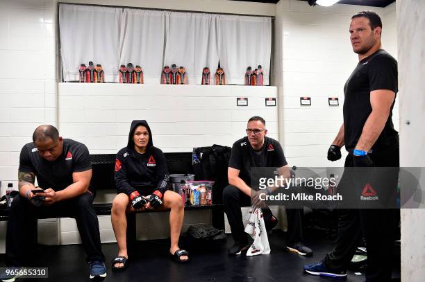 Sijara Eubanks waits backstage with coach Mark Henry and Ricardo Almeda during the UFC Fight Night event at the Adirondack Bank Center on June 1,...