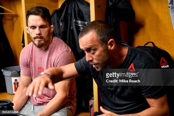 Jake Ellenberger and coach Jason Parillo wait backstage during the UFC Fight Night event at the Adirondack Bank Center on June 1, 2018 in Utica, New...