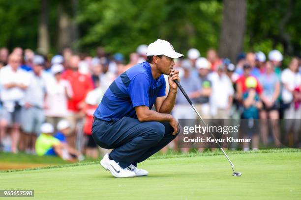 Tiger Woods reads his putt on the ninth hole green during the second round of the Memorial Tournament presented by Nationwide at Muirfield Village...