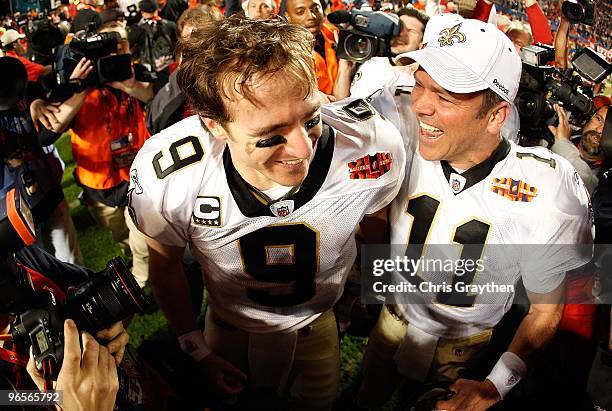 Drew Brees of the New Orleans Saints celebrates with Mark Brunell after defeating the Indianapolis Colts during Super Bowl XLIV on February 7, 2010...