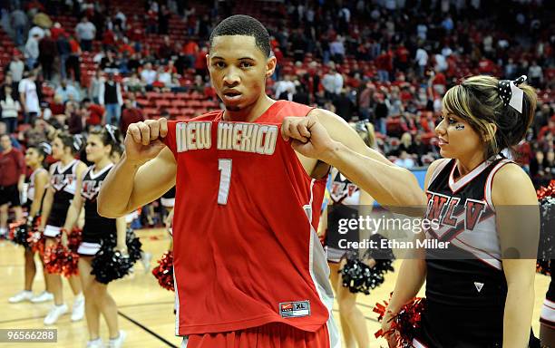 Darington Hobson of the New Mexico Lobos celebrates on the court in front of UNLV cheerleaders after the Lobos defeated the UNLV Rebels 76-66 at the...