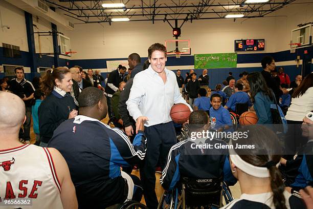 Dallas Mavericks owner Mark Cuban shakes hands with players during the NBA/NWBA All-Star Wheelchair Classic Basketbal Clinic as part of the 2010 NBA...