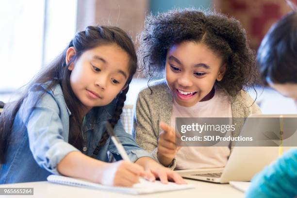 elementary schoolgirls brainstorm ideas - child discovering science stock pictures, royalty-free photos & images