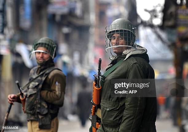 Indian paramilitary troopers stand alert during an undeclared curfew in Srinagar on February 11, 2010. A security lockdown and a general strike has...