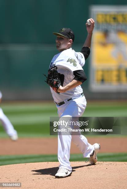 Trevor Cahill of the Oakland Athletics pitches against the Tampa Bay Rays in the top of the first inning at the Oakland Alameda Coliseum on May 28,...