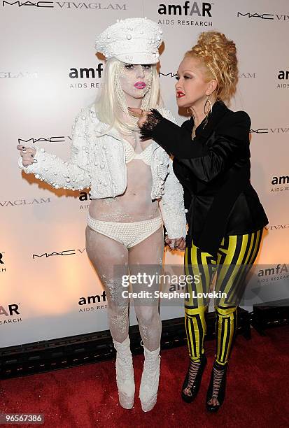 Musician Lady Gaga and singer Cyndi Lauper attend the amfAR New York Gala co-sponsored by M.A.C Cosmetics at Cipriani 42nd Street on February 10,...