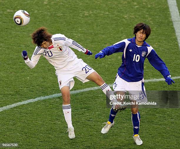 Kana Osafune of Japan and Huei Tzu Lo of Chinese Taipei compete for the ball during the East Asian Football Federation Women's Football Championship...