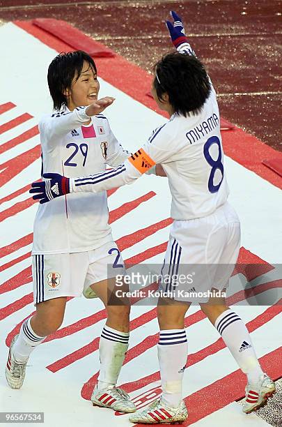 Mana Iwabuchi of Japan celebrates with her teammates Aya MIyama after scoring a goal during the East Asian Football Federation Women's Football...