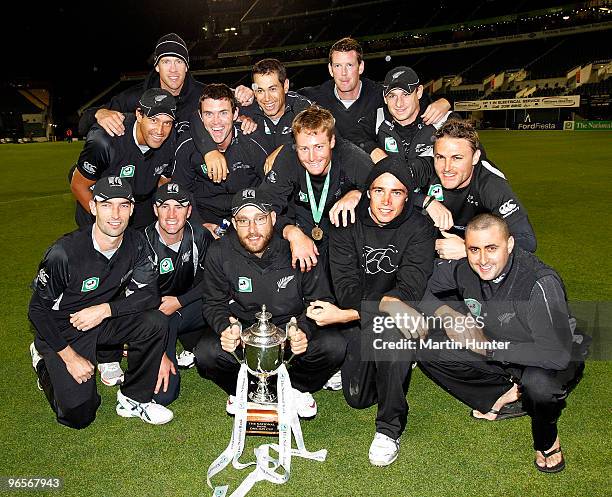 New Zealand Black Caps celebrate with the National Bank One Day Cup after the third One Day International match between the New Zealand Blacks Caps...