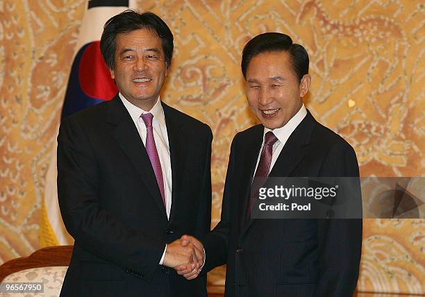 Japanese Foreign Minister Katsuya Okada shakes hands with South Korean President Lee Myung-Bak at the presidential house on February 11, 2010 in...