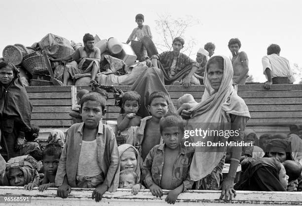 Rohingya refugees, a Muslim minority from Myanmar's Northern Rakhine state, wait to be returned home by the UNHCR, the UN Refugees Agency, from...