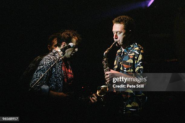 Joe Strummer performs on stage with The Pogues at Brixton Academy on December 11th, 1991 in London, United Kingdom.