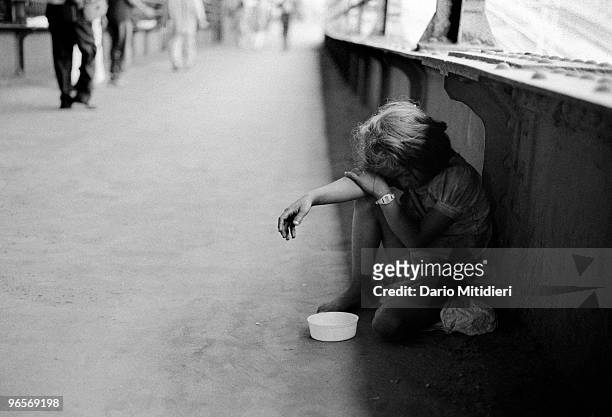 Street child begging near Victoria Terminus Train Station.