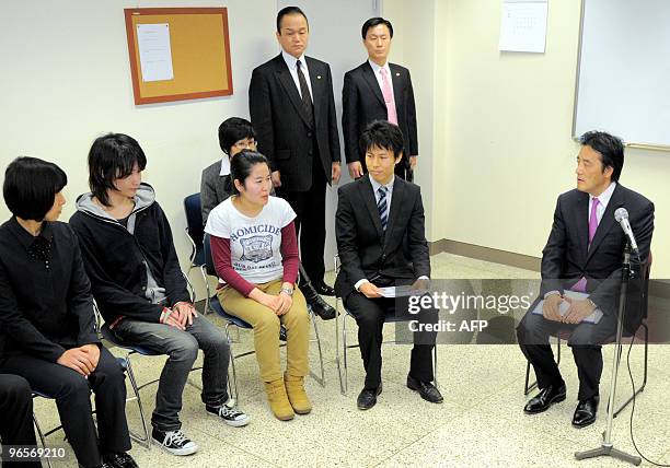 Japanese Foreign Minister Katsuya Okada talks with South Korean students during a visit to the Yonsei University in Seoul on February 11, 2010. Okada...