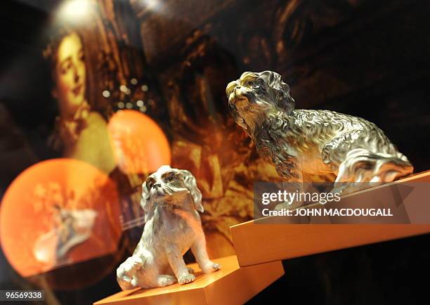 An exhibit features two dogs made of Meissen porcelain, commissioned by French aristocrat and Louis the XV mistress Mme de Pompadour who wanted to...