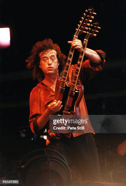 Led Zeppelin guitarist Jimmy Page of Page and Plant performs on stage on Day 3 of The Glastonbury Festival in Somerset on June 25th, 1995 in...