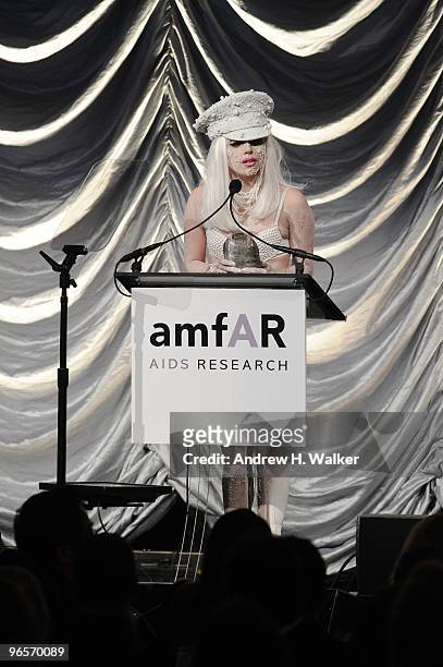 Singer Lady Gaga speaks onstage at the amfAR New York Gala co-sponsored by M.A.C Cosmetics at Cipriani 42nd Street on February 10, 2010 in New York,...