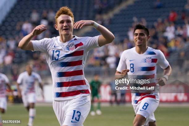 Josh Sargent of the United States celebrates after scoring a goal along with Joe Corona during the friendly soccer match against Bolivia at Talen...