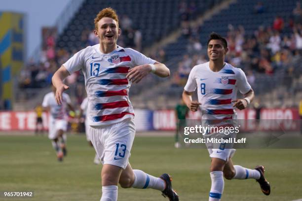 Josh Sargent of the United States celebrates after scoring a goal along with Joe Corona during the friendly soccer match against Bolivia at Talen...