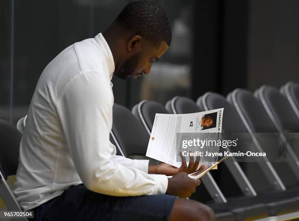 Harrison Gaines, agent for Lonzo Ball of the Los Angeles Lakers looks over the bio of LiAngelo Ball during the NBA Pre-Draft Workout with the Los...