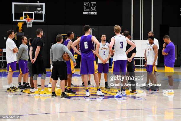 Participating players listen as head coach Luke Walton of the Los Angeles Lakers talks after the completition of the Los Angeles Lakers 2018 NBA...