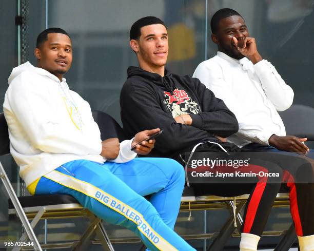 Trainer Darren Moore, Lonzo Ball of the Los Angeles Lakers and agent Harrison Gaines watch during the NBA Pre-Draft Workout held by the Los Angeles...