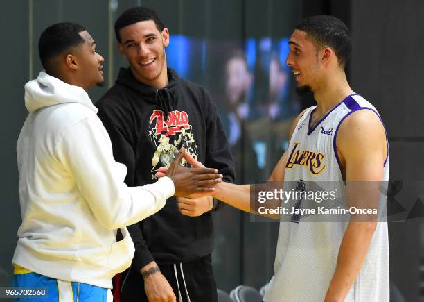 Trainer Darren Moore and Lonzo Ball of the Los Angeles Lakers greets LiAngelo Ball after he completed his NBA Pre-Draft Workout with the Los Angeles...