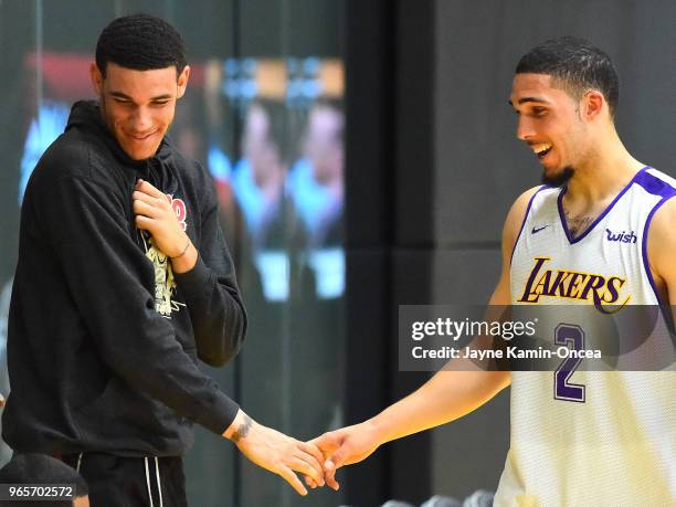 Lonzo Ball of the Los Angeles Lakers greets his brother LiAngelo Ball after he completed his NBA Pre-Draft Workout with the Los Angeles Lakers on May...