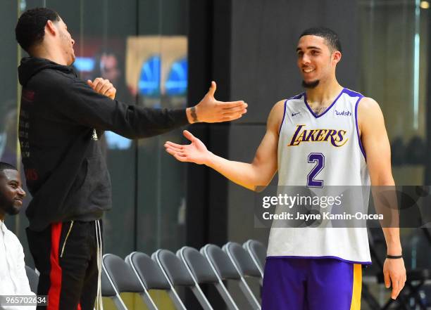 Lonzo Ball of the Los Angeles Lakers greets his brother LiAngelo Ball after he completed his NBA Pre-Draft Workout with the Los Angeles Lakers on May...