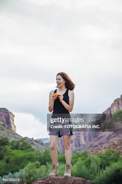 trekking in moab - snacking on the go stock pictures, royalty-free photos & images