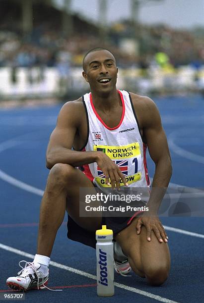 Colin Jackson of Great Britain looks tired but pleased with second place after the 110 metres hurdles at the Norwich Union Challenge between Great...