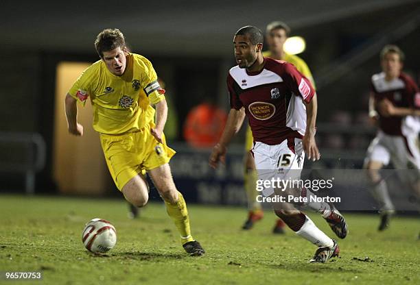 Alex Dyer of Northampton Town moves away from Andrew Procter of Accrington Stanley during the Coca Cola League Two Match between Northampton Town and...