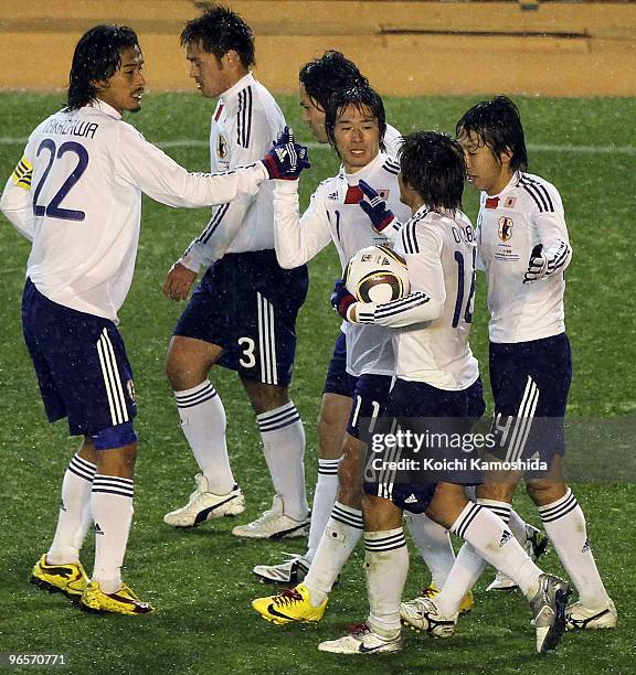 Keiji Tamada of Japan celebrates with his teammates during the East Asian Football Championship 2010 match between Japan and Hong Kong at the...