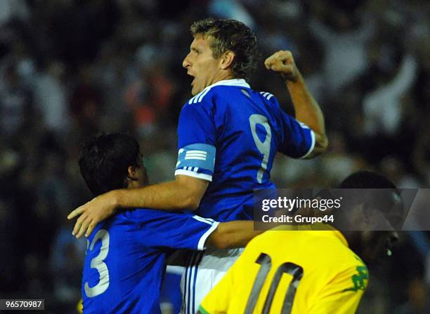 Martin Palermo of Argentina celebrates his goal with team mate against of Jamaica during a friendly match on February 10, 2010 in Mar del Plata,...