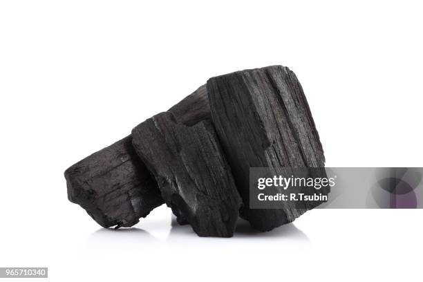 hardwood charcoal coal isolated on white background - kohle stock-fotos und bilder