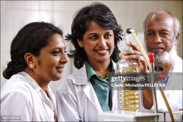 Pr. Ameenah Gurib-Fakin, with Ouma and Kader concentrating plants extracts with rotary evaporator in the lab at the University of Mauritius. Ameenah...