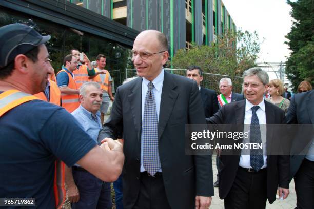 Le premier ministre Italien Enrico Letta, avec a sa droite le president de la region Emilie-Romagne Vasco Errani, visite la societe 'Menu' , un an...